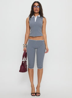 front view of model wearing Princess Polly Tuka Capri Navy Gingham Mid Rise Pants 