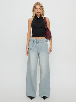 side view of model wearing Princess Polly Paltrow Mid Rise Wide Leg Cargo Jeans Faded Blue Wash Mid Rise Jeans 