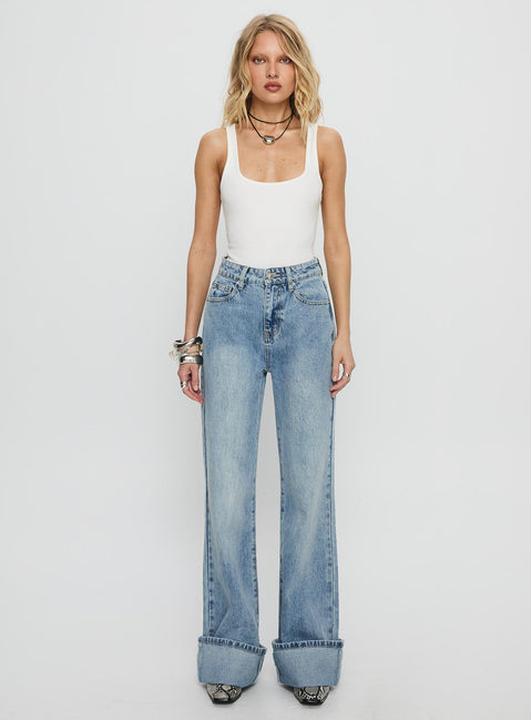 side view of model wearing Princess Polly Florida Keys Mid Rise Straight Leg Cuffed Jeans Light Blue Wash High Waisted Jeans 