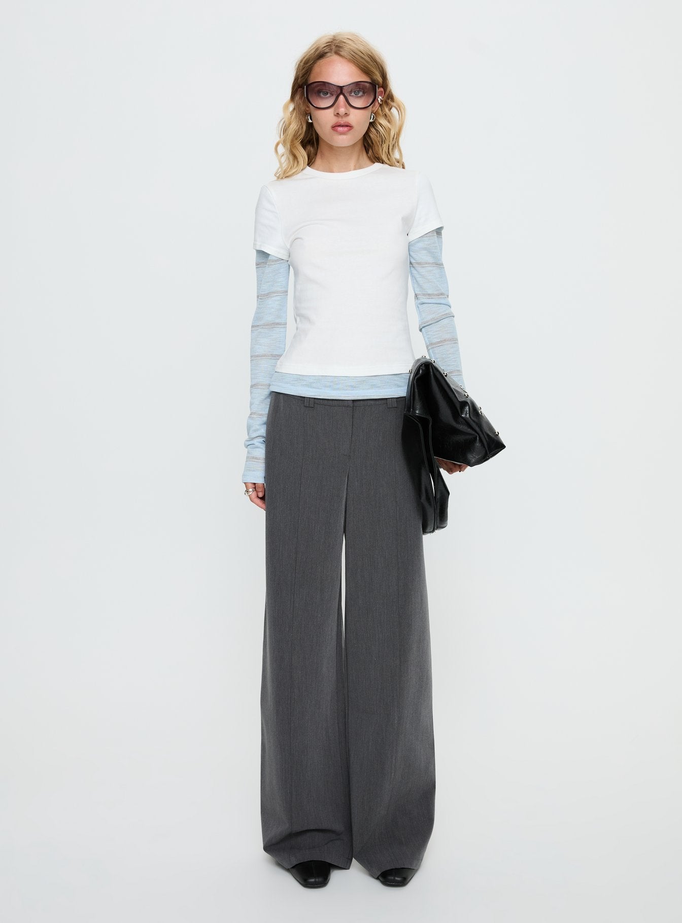front view of model wearing Princess Polly Sarito Low Rise Straight Leg Pants Grey Mid Rise Pants 