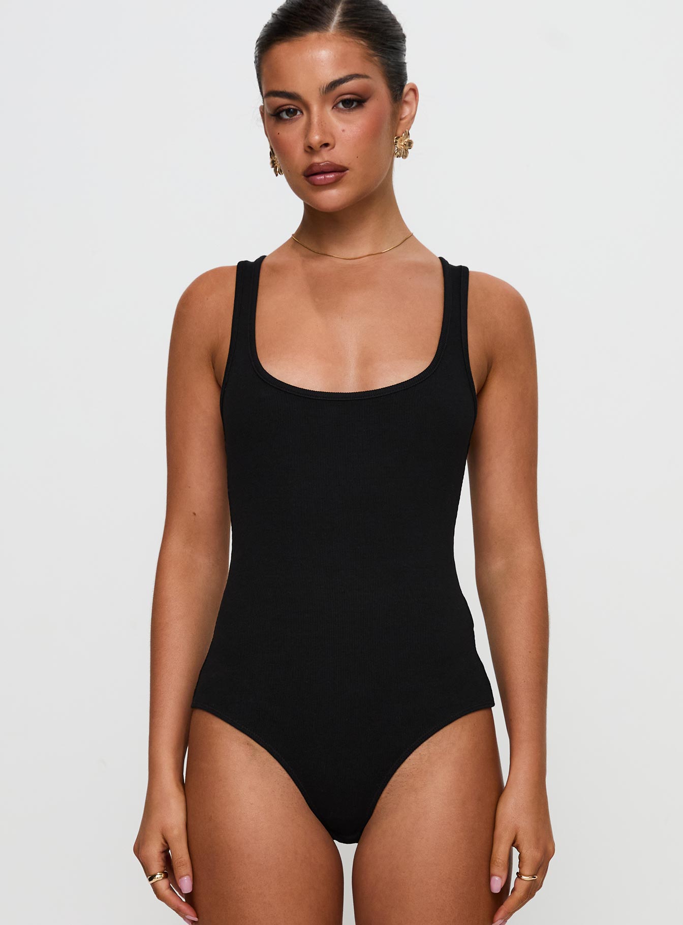 front view of model wearing Princess Polly Baseline Rib Bodysuit Black Sleeveless 