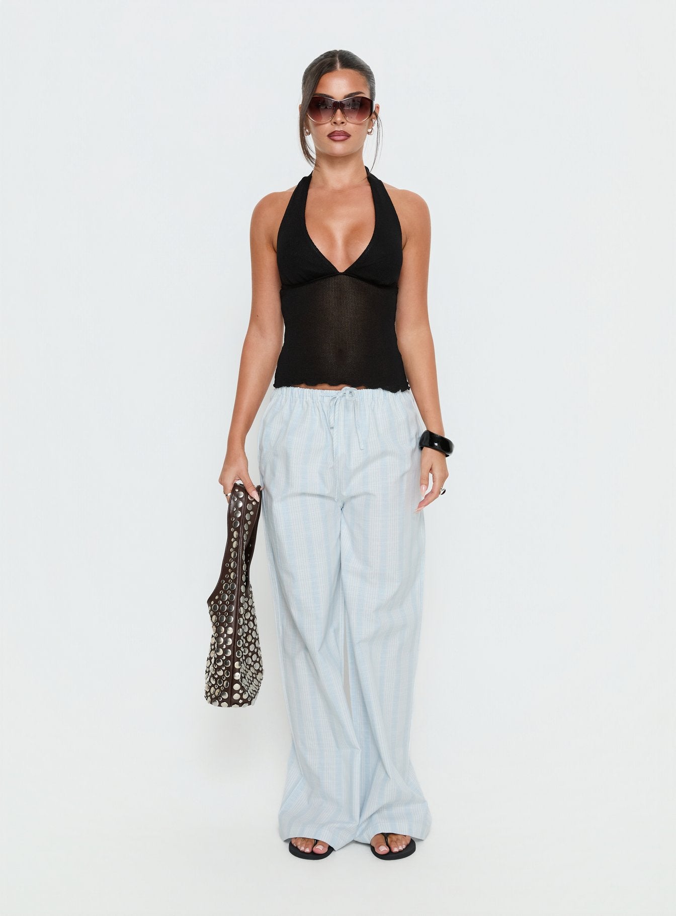 side view of model wearing Princess Polly Parklea Pants Blue / White Stripe High Rise Pants 
