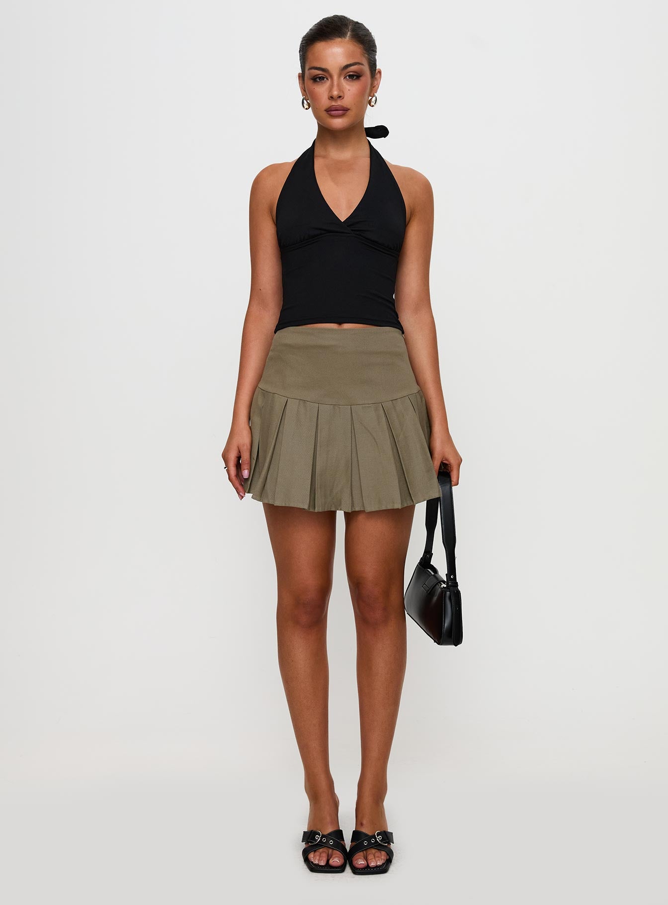   front view of model wearing Princess Polly Feodora Pleat Mini Skirt Khaki Mini Skirts 