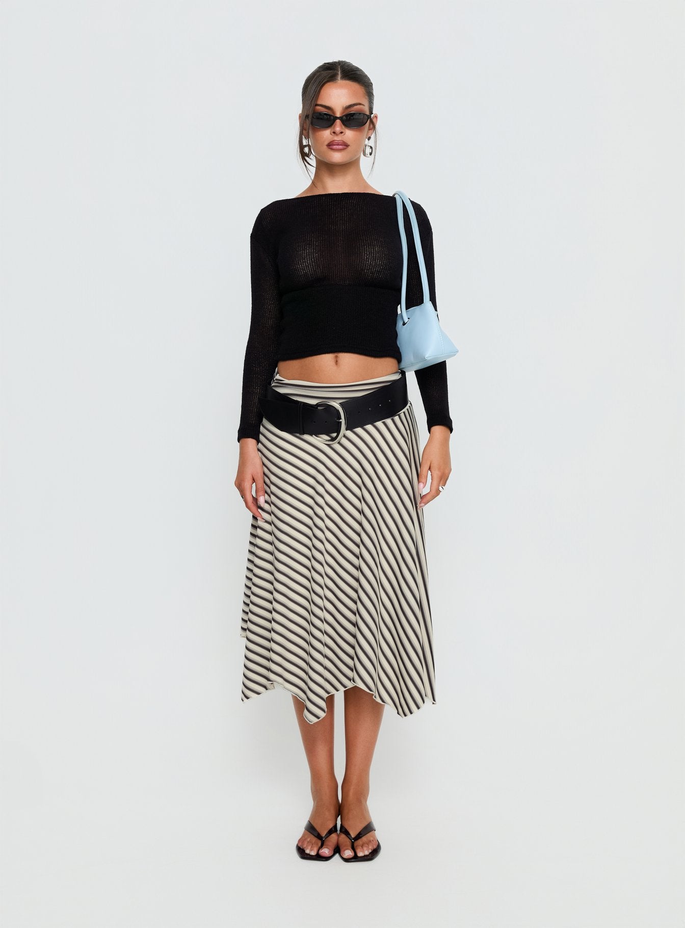   side view of model wearing Princess Polly Cobee Asymmetrical Midi Skirt Multi Stripe Midi Skirts 