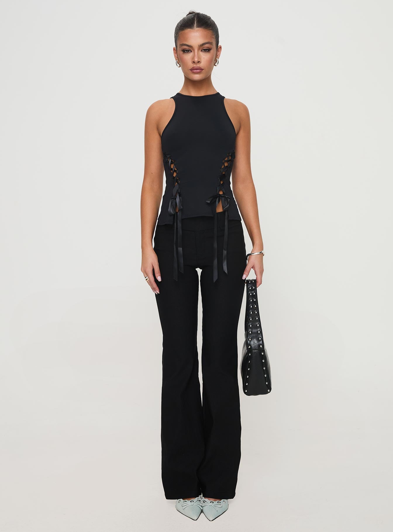 front view of model wearing Princess Polly Bisous Top Black Sleeveless Crew Neck 