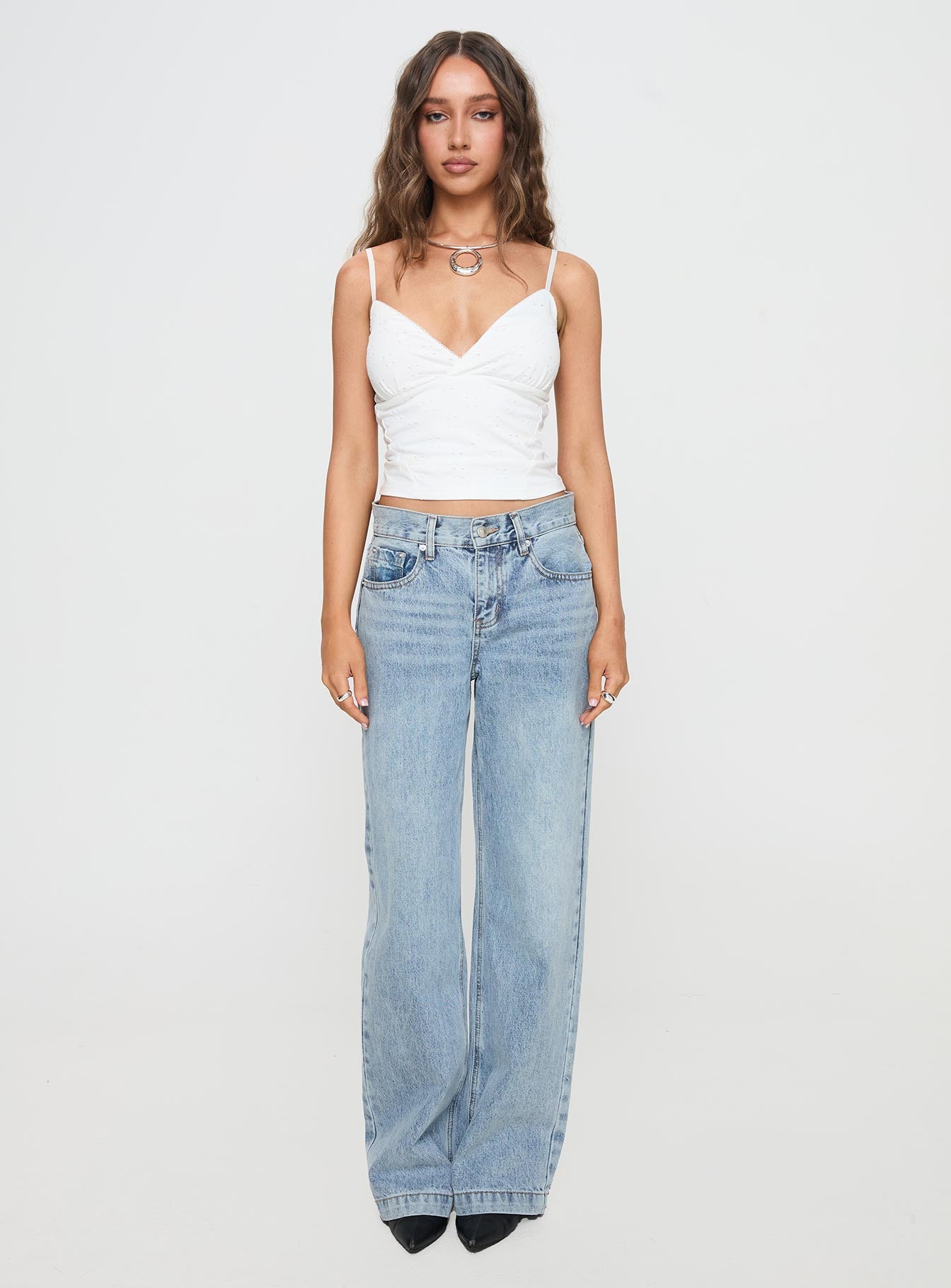 front view of model wearing Princess Polly Anelli Low Rise Straight Leg Jeans Light Blue Wash High Waisted 