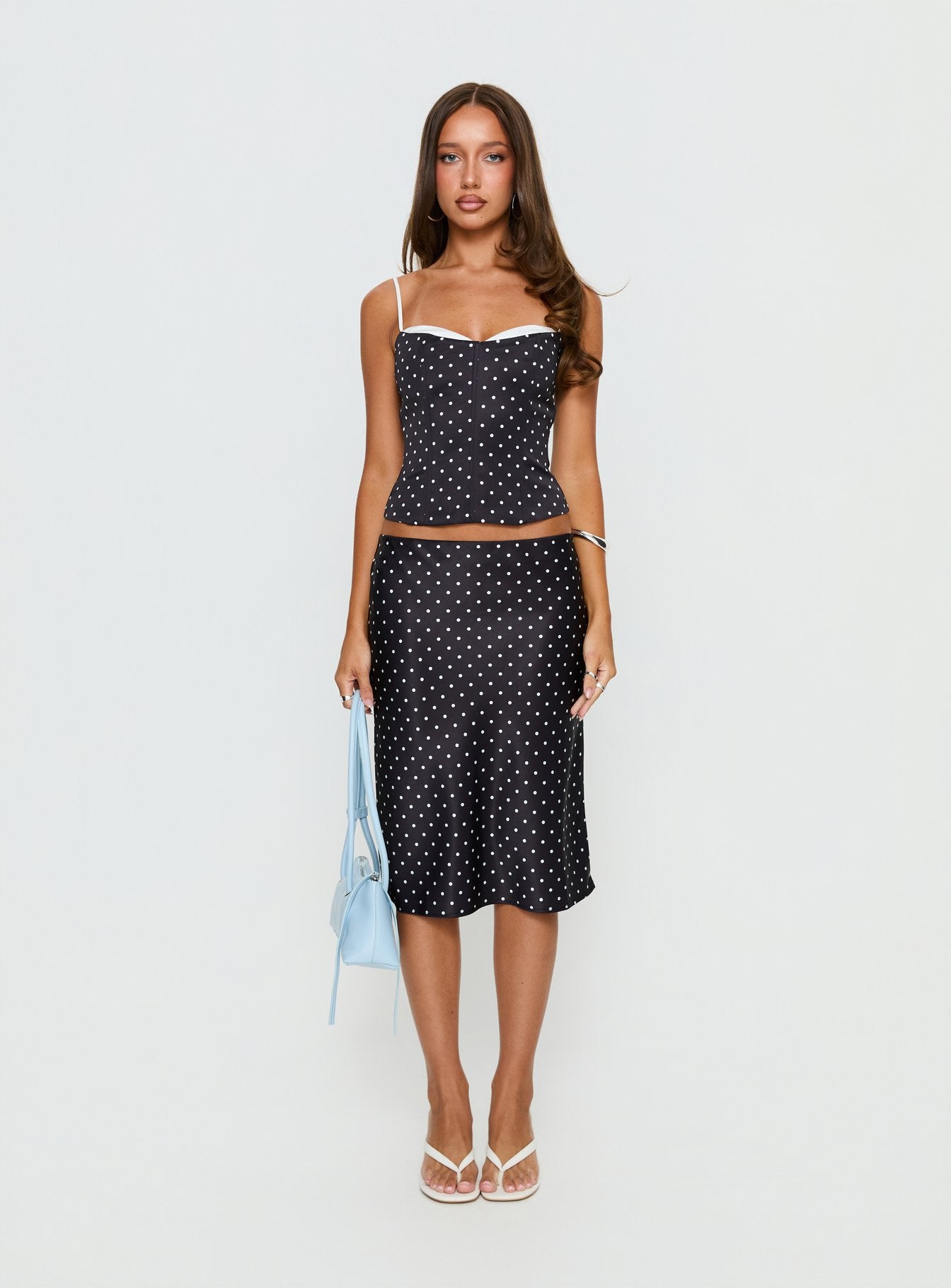   front view of model wearing Princess Polly Somani Satin Midi Skirt Black Polka Dot Midi Skirts 