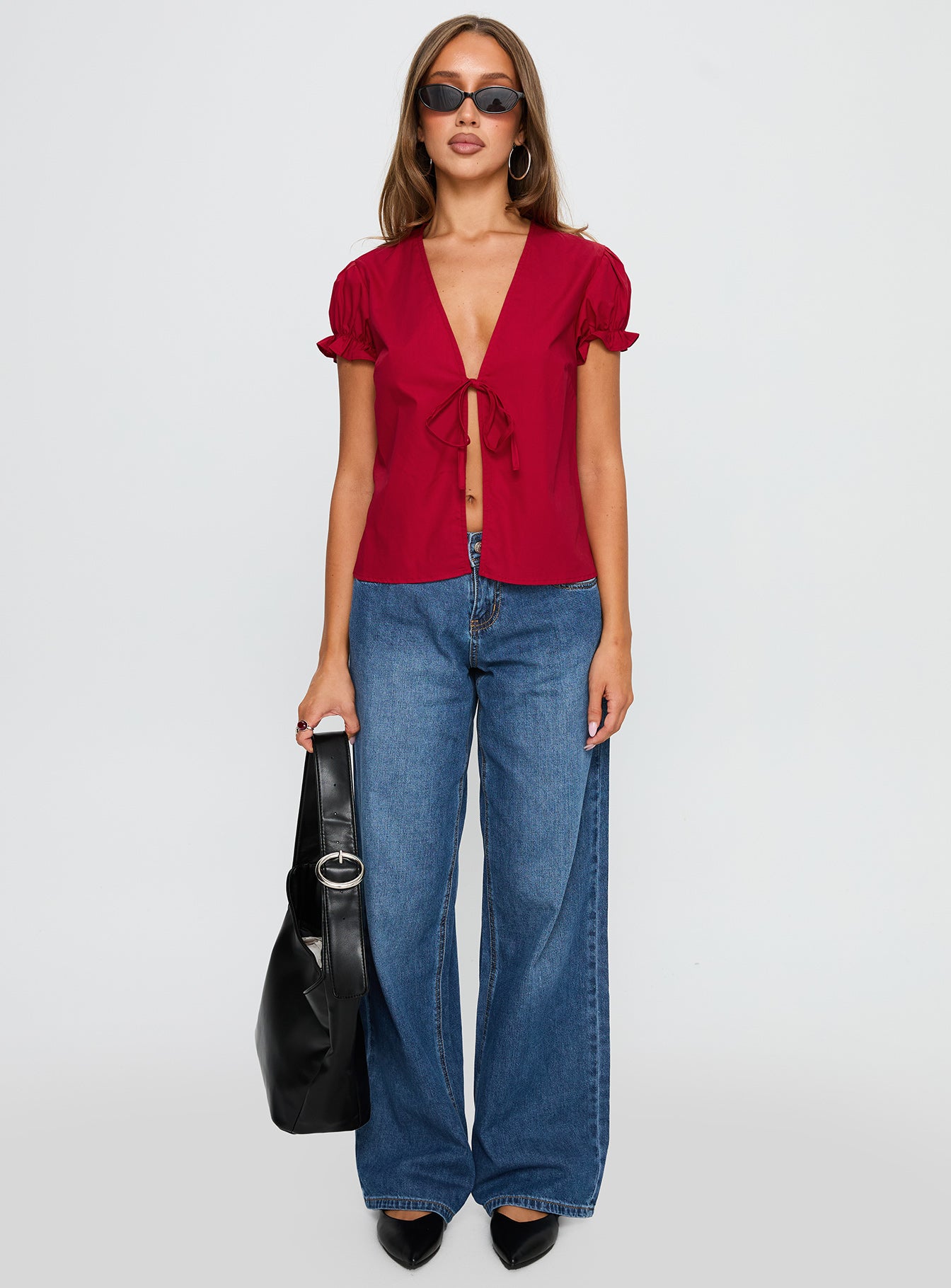 front view of model wearing Princess Polly Starstruck Tie Up Top Red Short Sleeves V-Neck 