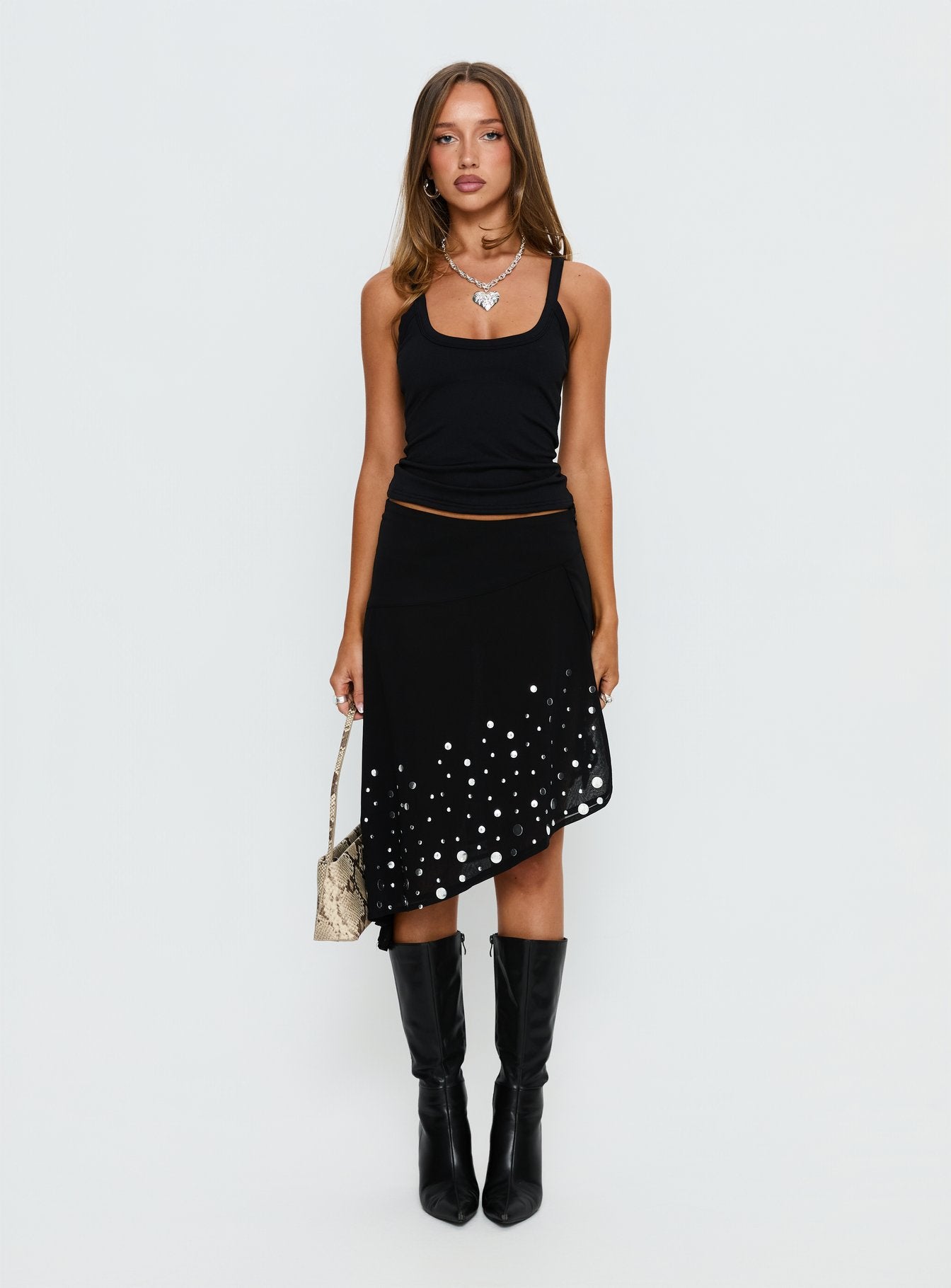   front view of model wearing Princess Polly Jezabela Asymmetrical Stud Midi Skirt Black 