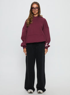 front view of model wearing Princess Polly Kisses Graphic Hoodie Wine Longline Jumpers 