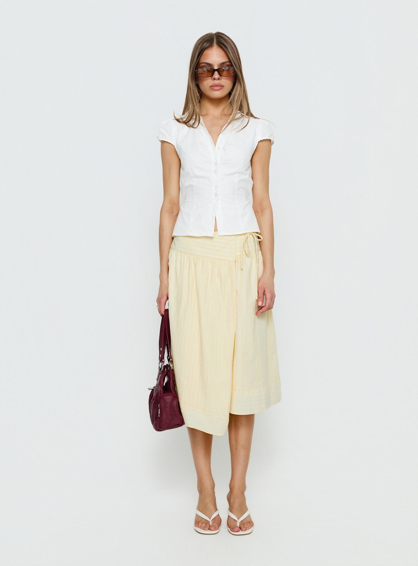   side view of model wearing Princess Polly Sunney Wrap Midi Skirt Yellow Midi Skirts 