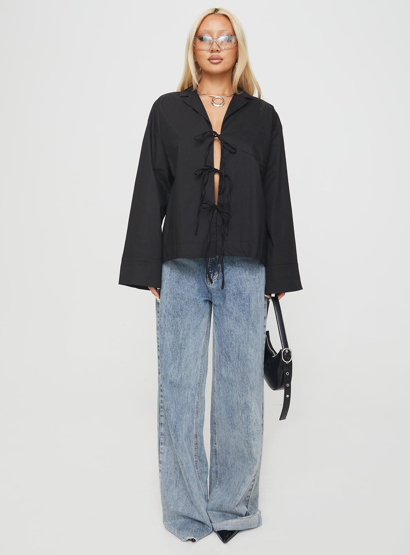 front view of model wearing Princess Polly Spiri Shirt Black Full Sleeves V-Neck 