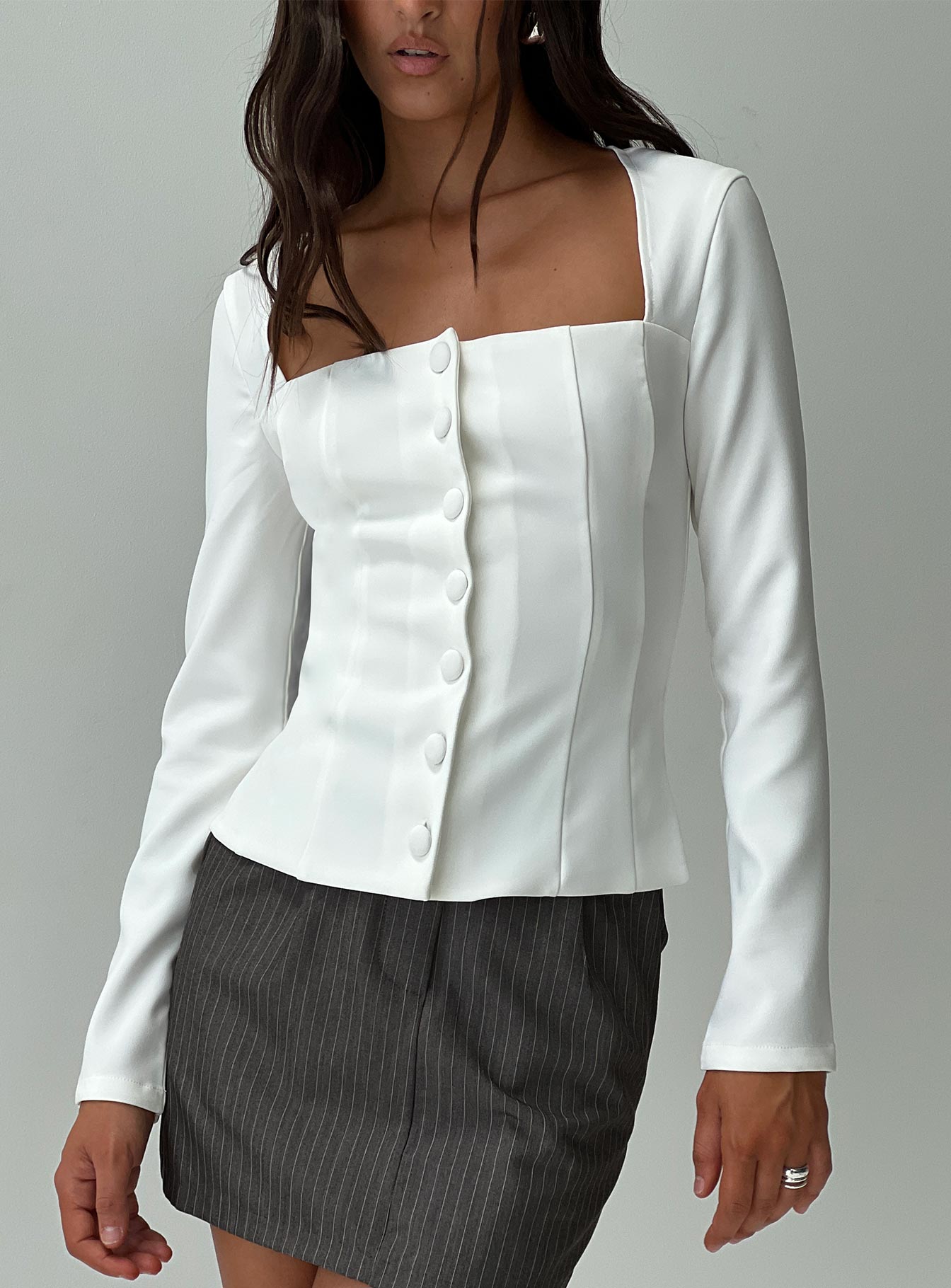 front view of model wearing Princess Polly Gaskin Long Sleeve Top White Full Sleeves Square Neck 