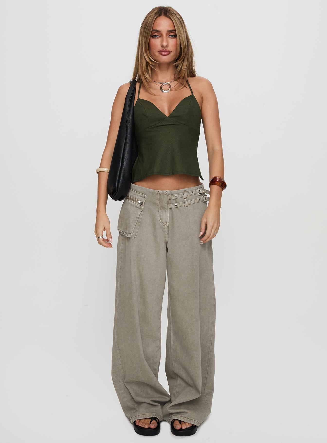 side view of model wearing Princess Polly Hopelessly Devoted Top Forest Green Sleeveless Plunger 