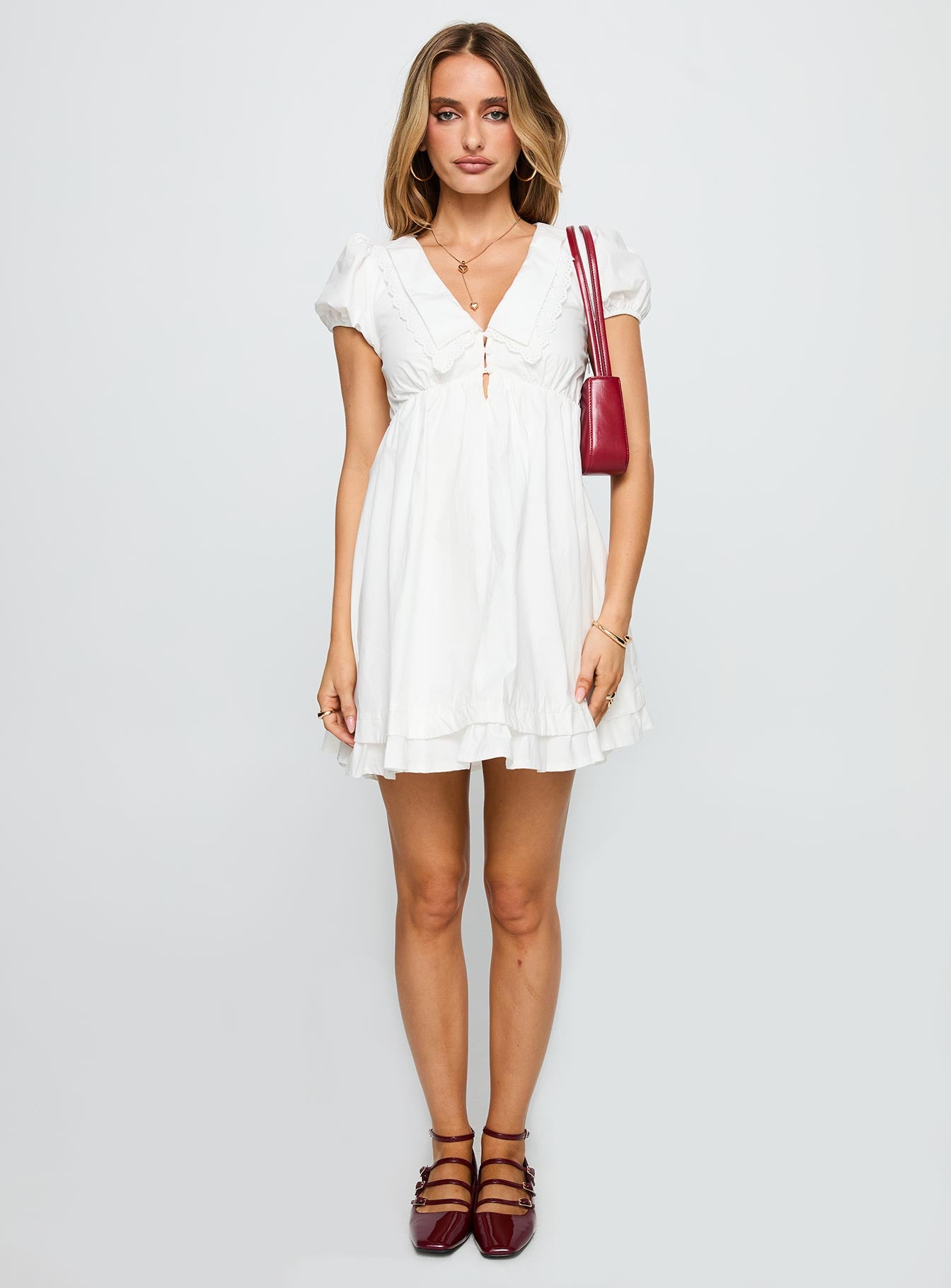 front view of model wearing Princess Polly Sailoh Puff Sleeve Baby Doll Mini Dress White V-Neck 