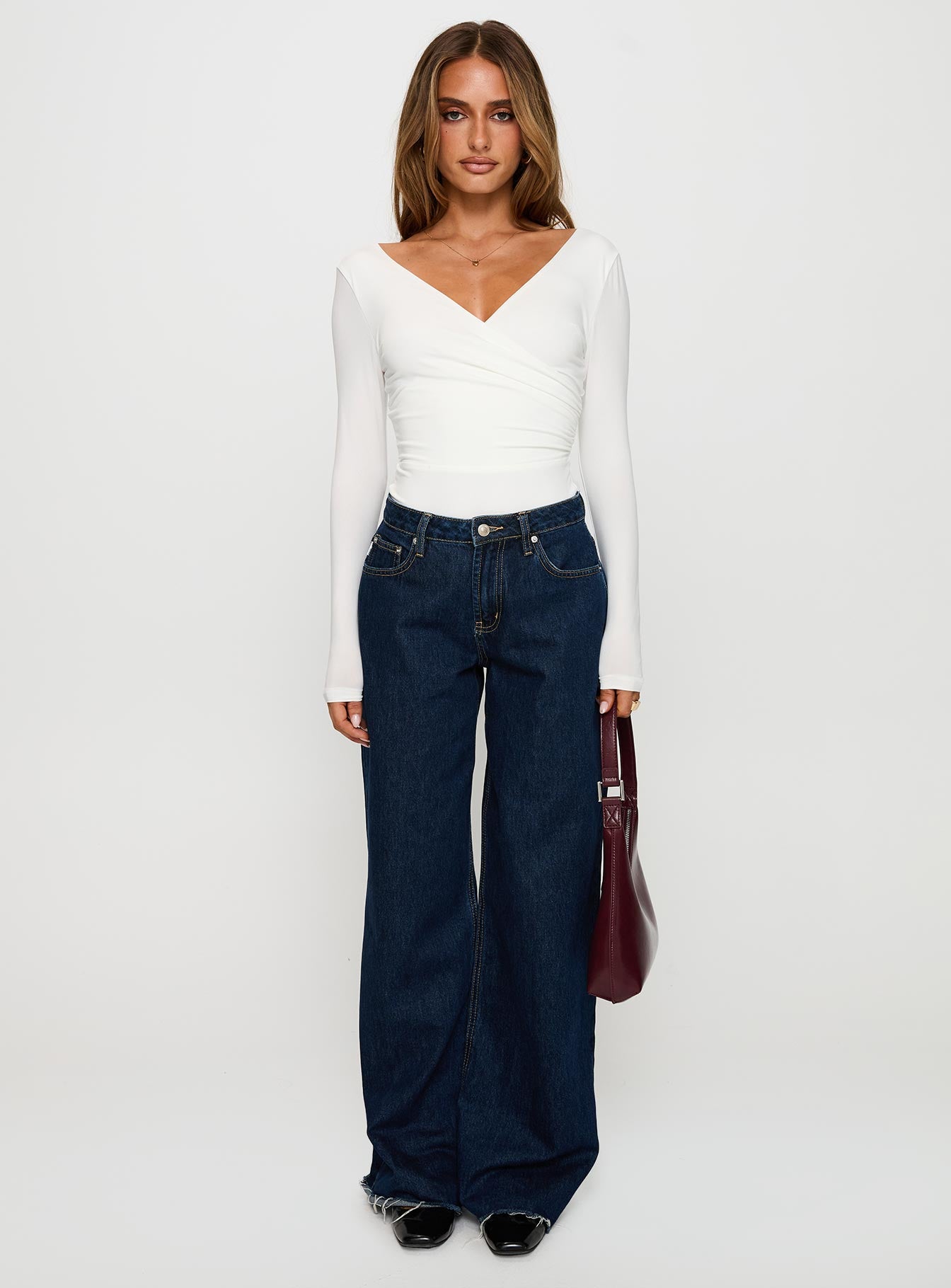 side view of model wearing Princess Polly Right Here Cross Detail Bodysuit White Long Sleeve Tops 