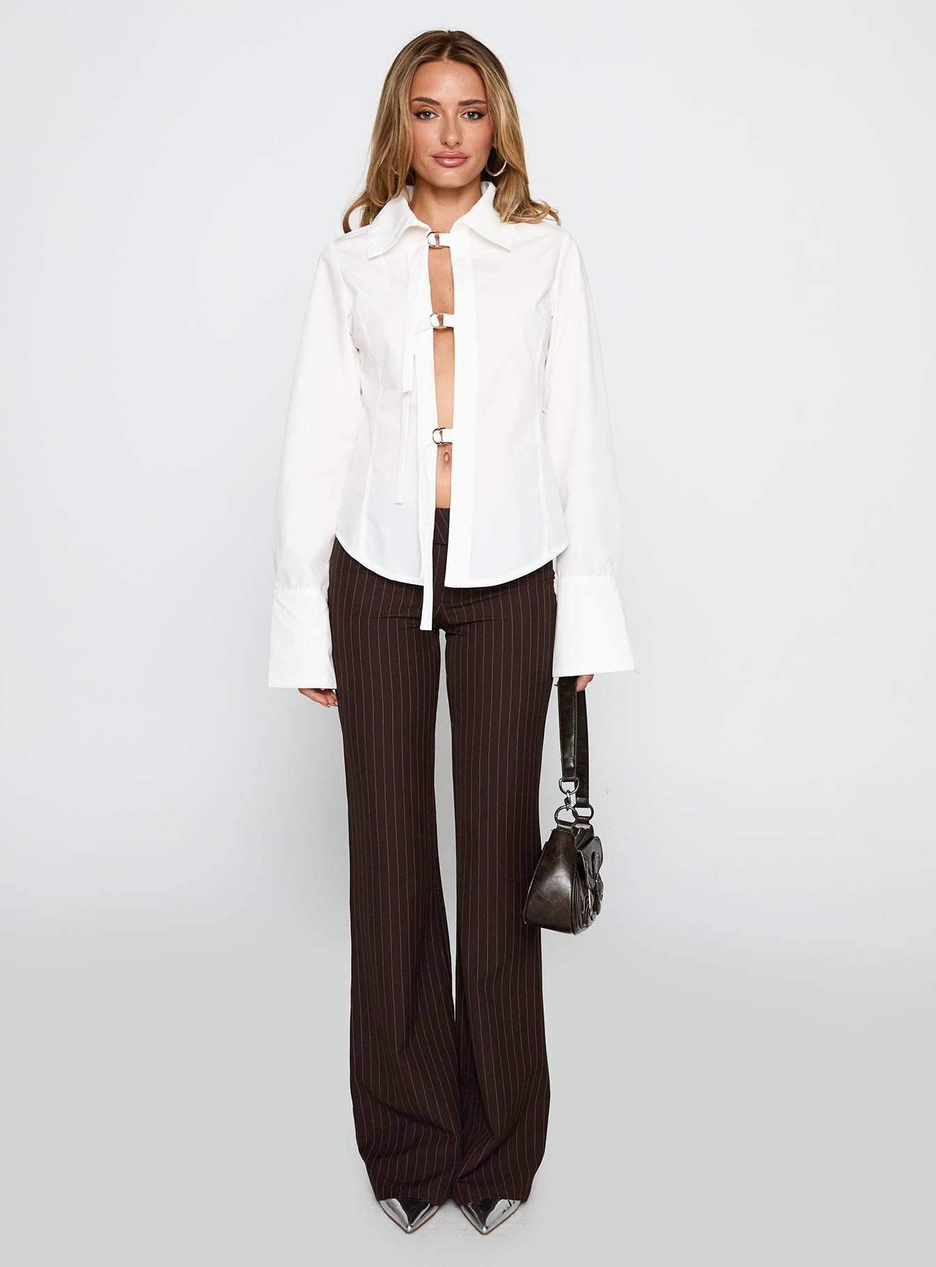 side view of model wearing Princess Polly The Temptation Long Sleeve Top White Full Sleeves High Neck 