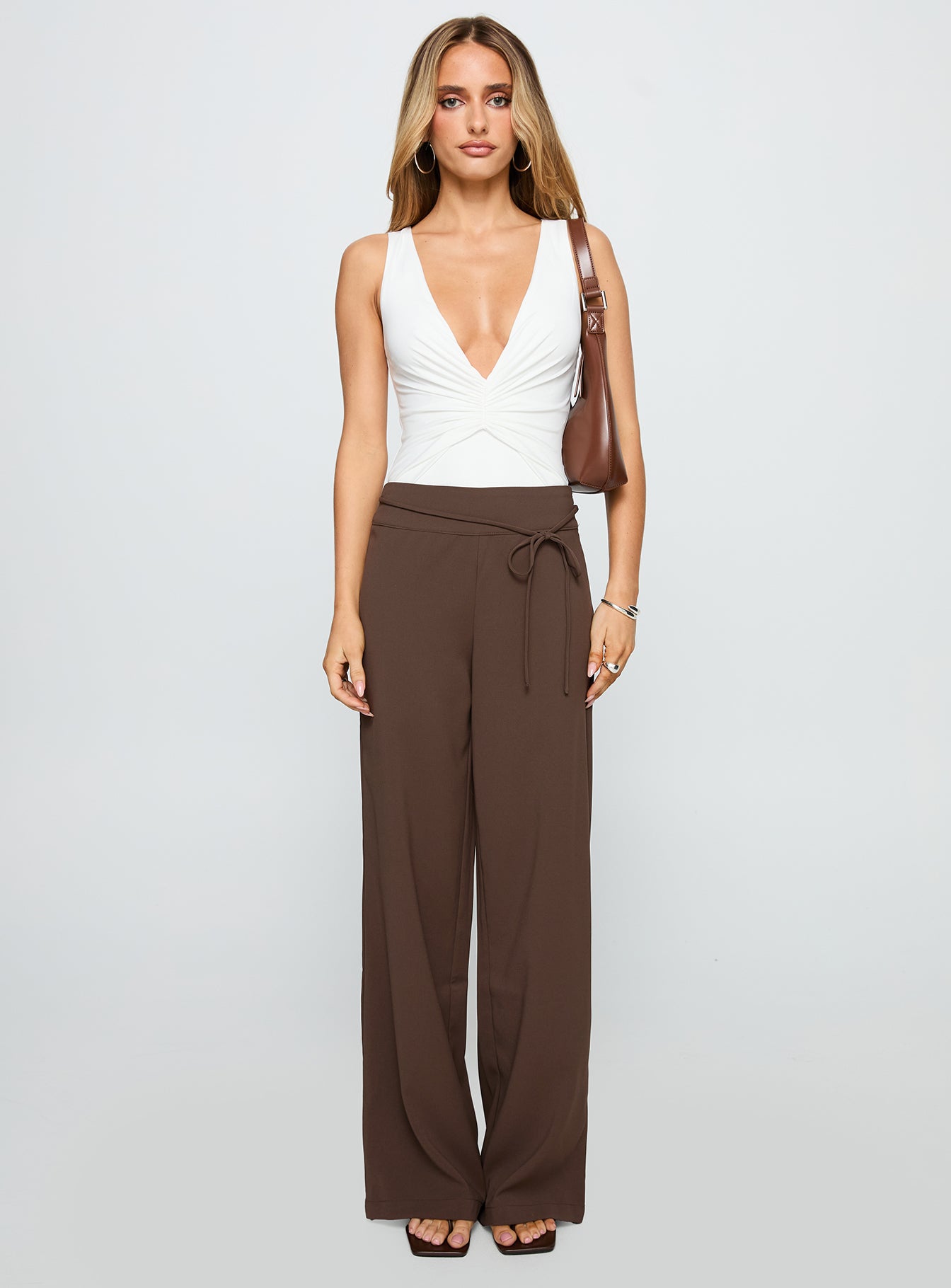 front view of model wearing Princess Polly Rush Hours Pants Chocolate High Waisted Pants 