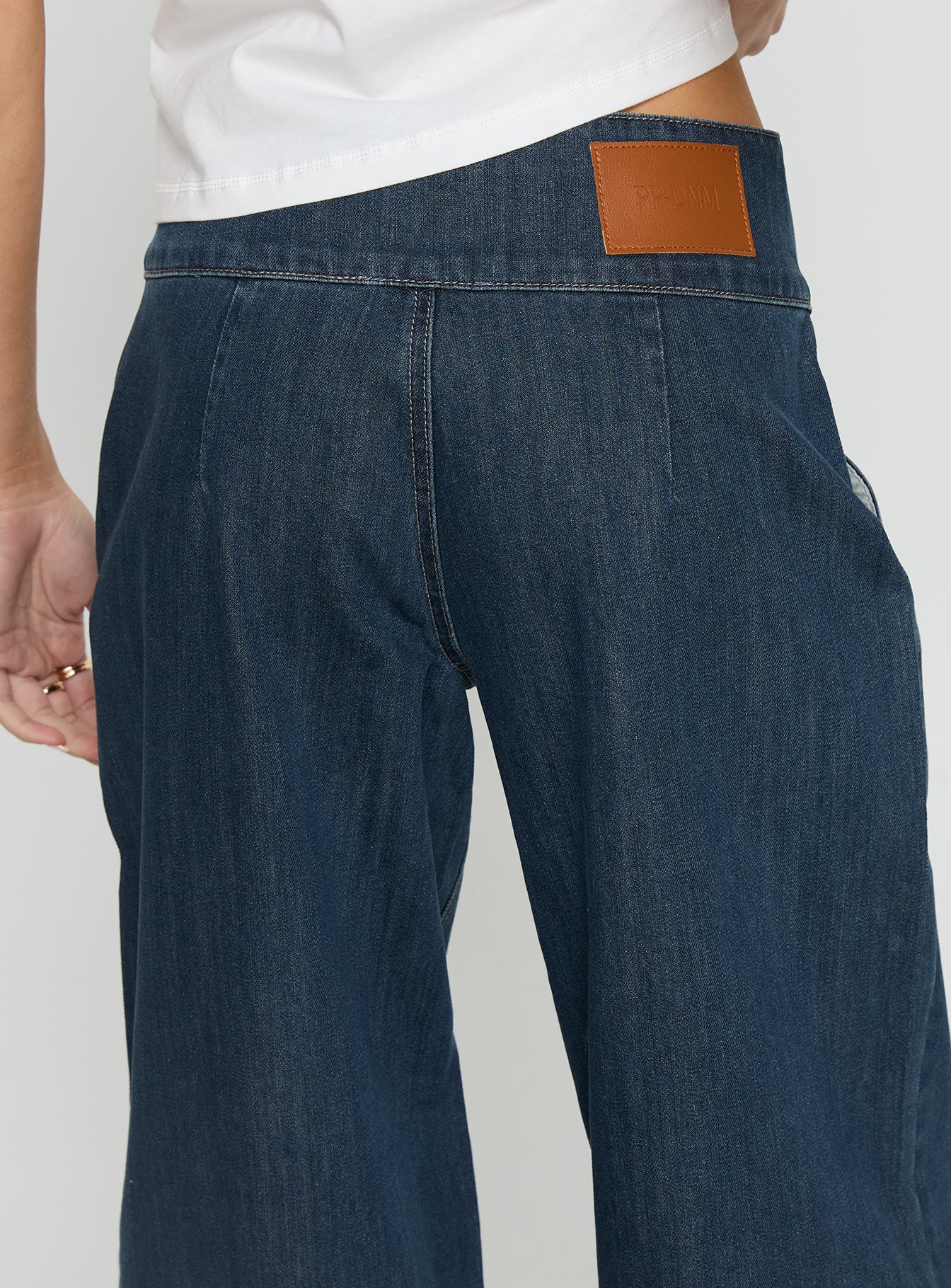 back view of model wearing Princess Polly Nikoletta Foldover Jeans Dark Wash / Check Mid Rise Jeans 