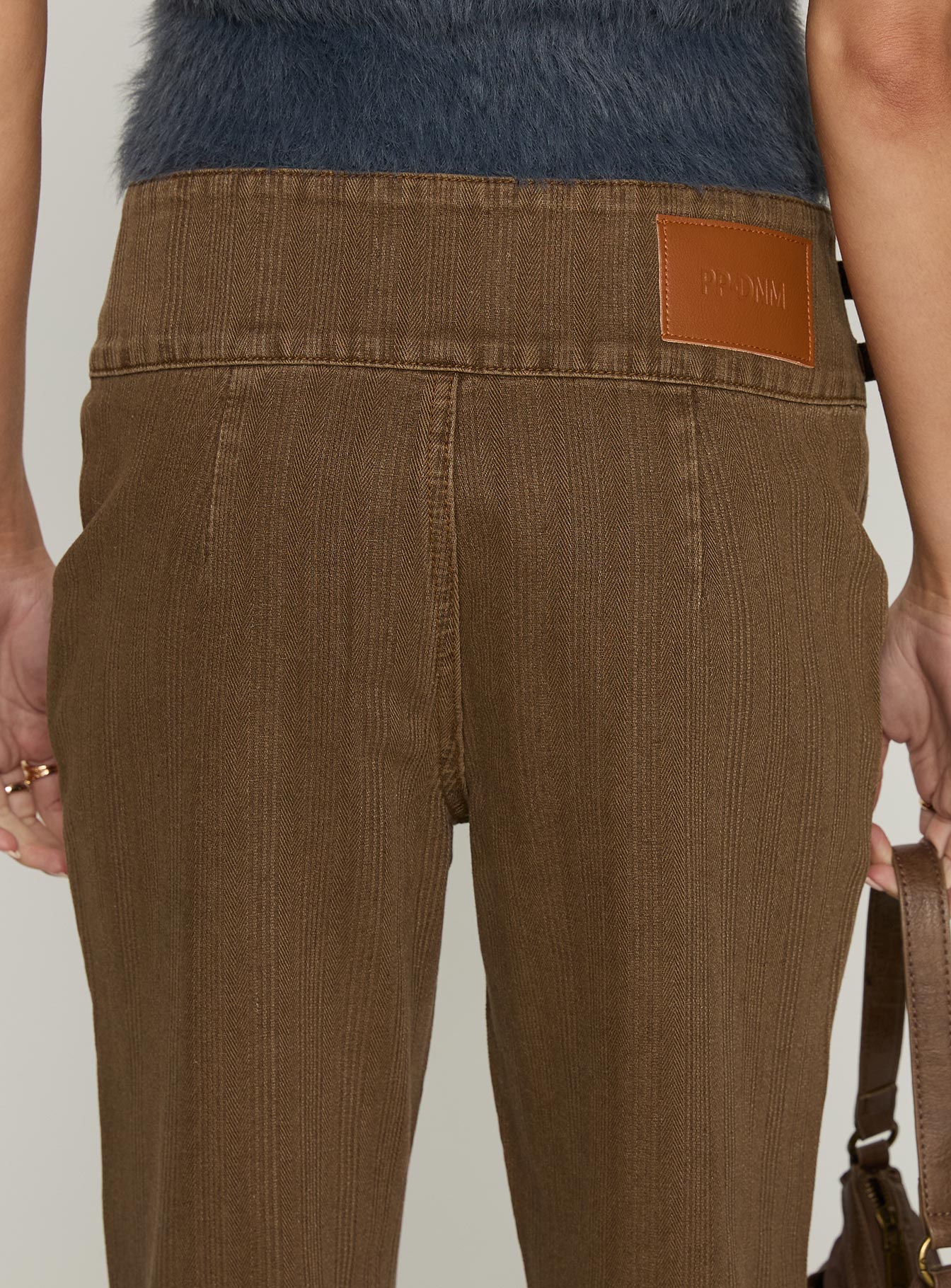 back view of model wearing Princess Polly Thrill Ride Mid Rise Corduroy Flare Jeans Washed Brown Mid Rise Jeans 