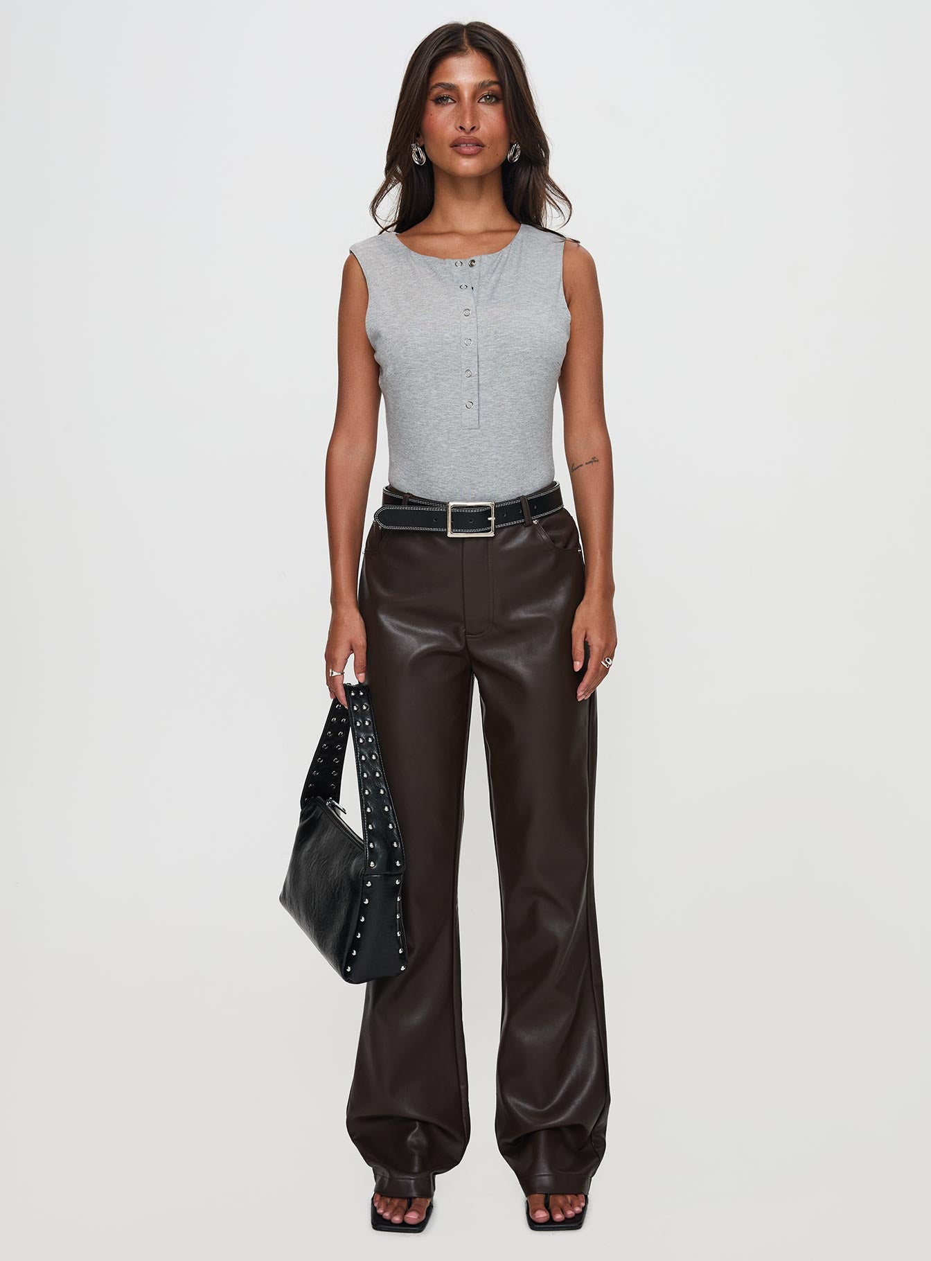 side view of model wearing Princess Polly Nolene Low Rise Pants Chocolate High Waisted Pants 