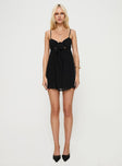 front view of model wearing Princess Polly Granno Mini Dress Black Sweetheart Neckline 