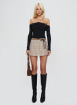 front view of model wearing Princess Polly Korren Low Rise Skort Plaid Low Rise Shorts 