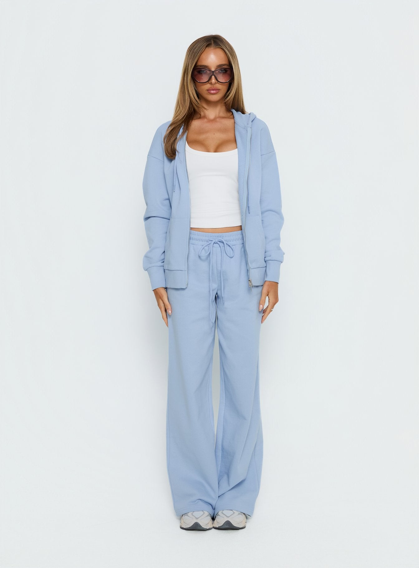 back view of model wearing Princess Polly All Day Straight Leg Sweatpants Icy Blue Mid Rise Pants 