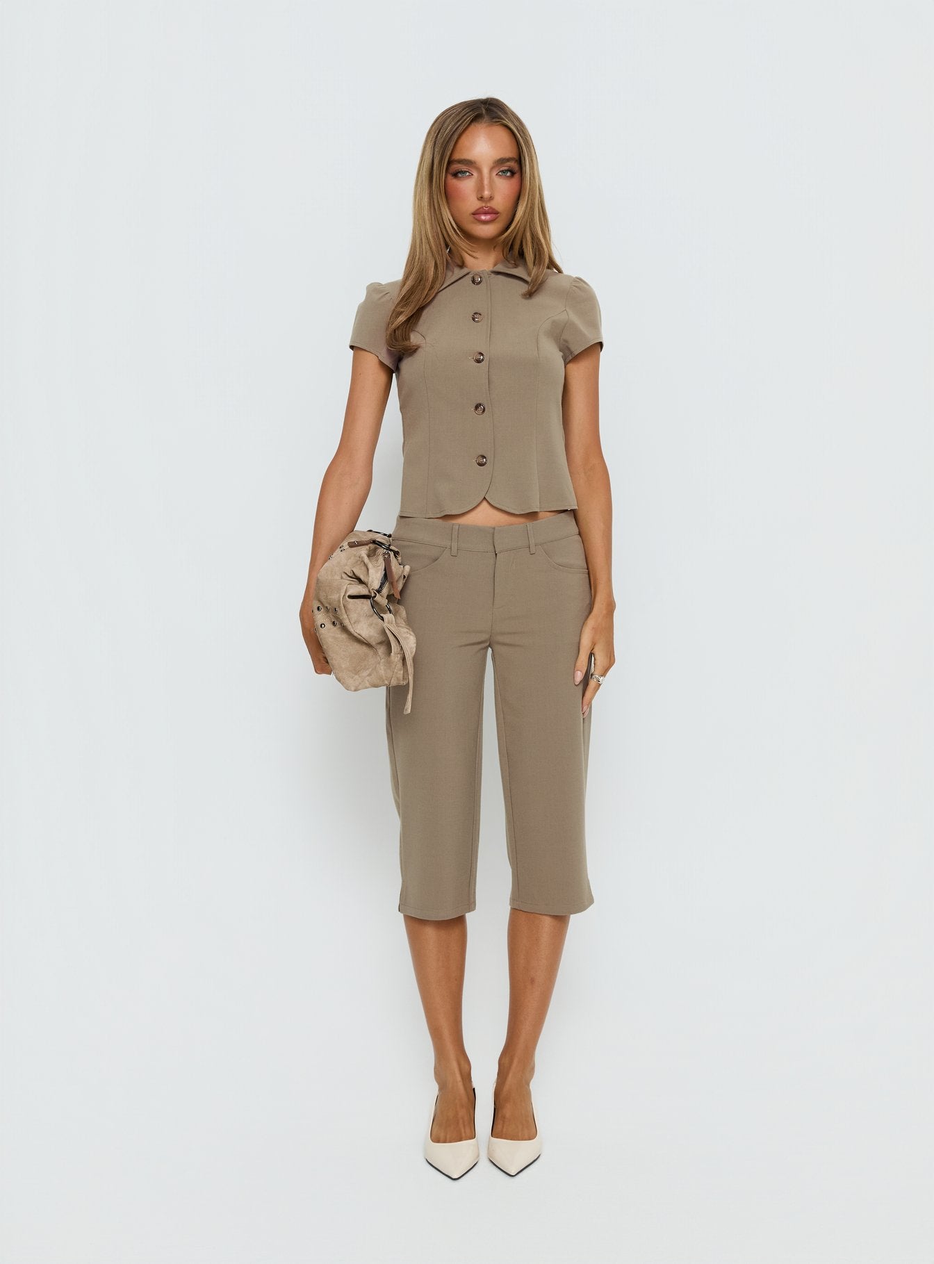 front view of model wearing Princess Polly Tunian Capri Tailored Pants Taupe Mid Rise Pants 
