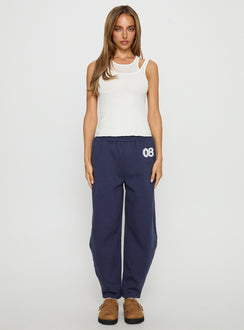 front view of model wearing Princess Polly Route 08 Barrel Track Pant Navy Mid Rise Pants 