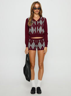 front view of model wearing Princess Polly Raiven Knit Cardigan Burgundy Argyle cropped 