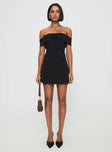 side view of model wearing Princess Polly Lanes Off The Shoulder Mini Dress Black Straight Neck 