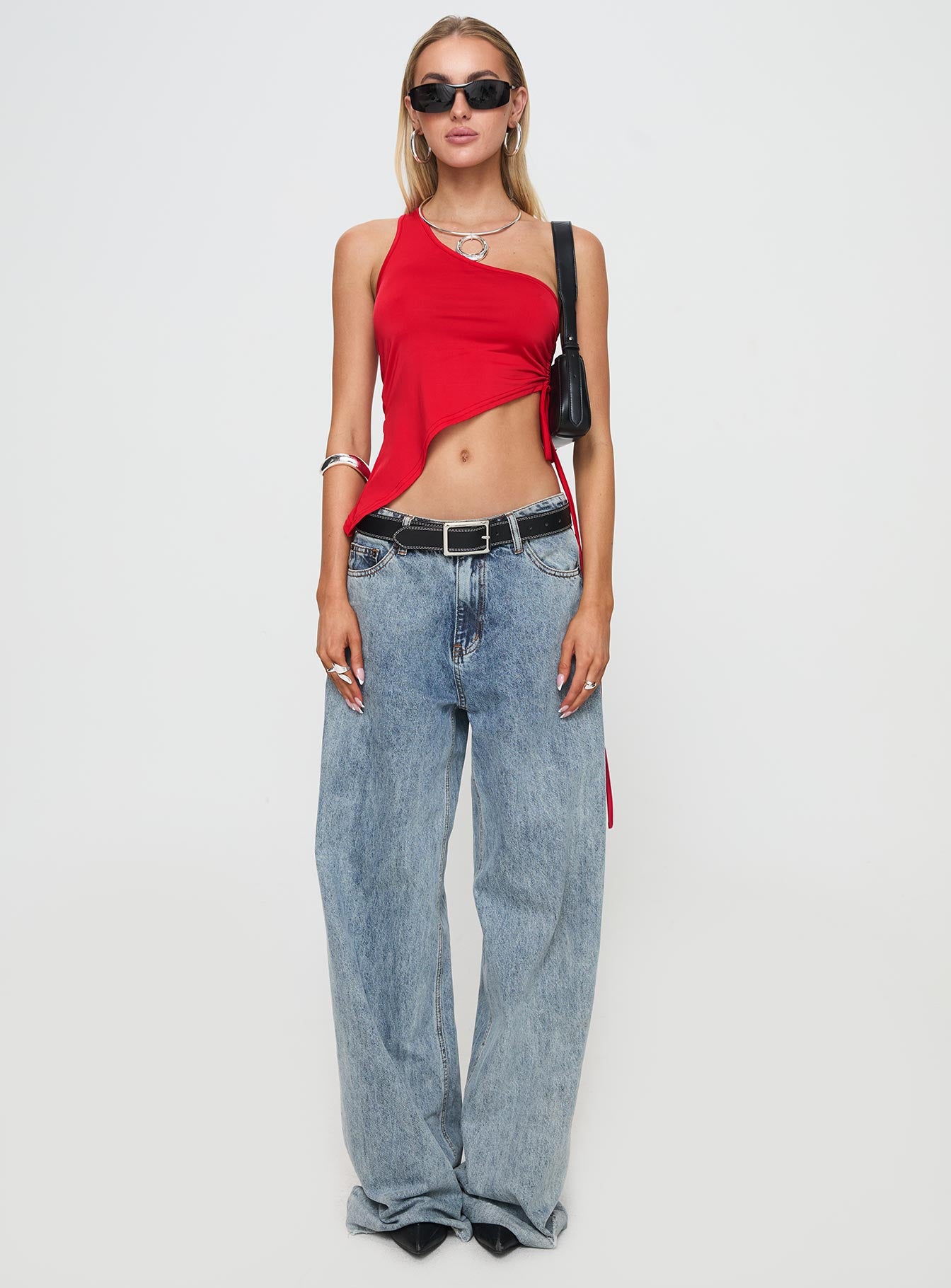 front view of model wearing Princess Polly Servina Top Red Sleeveless Asymmetric Neckline 