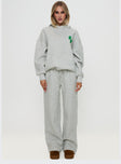 side view of model wearing Princess Polly Princess Polly Hooded Sweatshirt Bubble Text Grey Marle / Green 