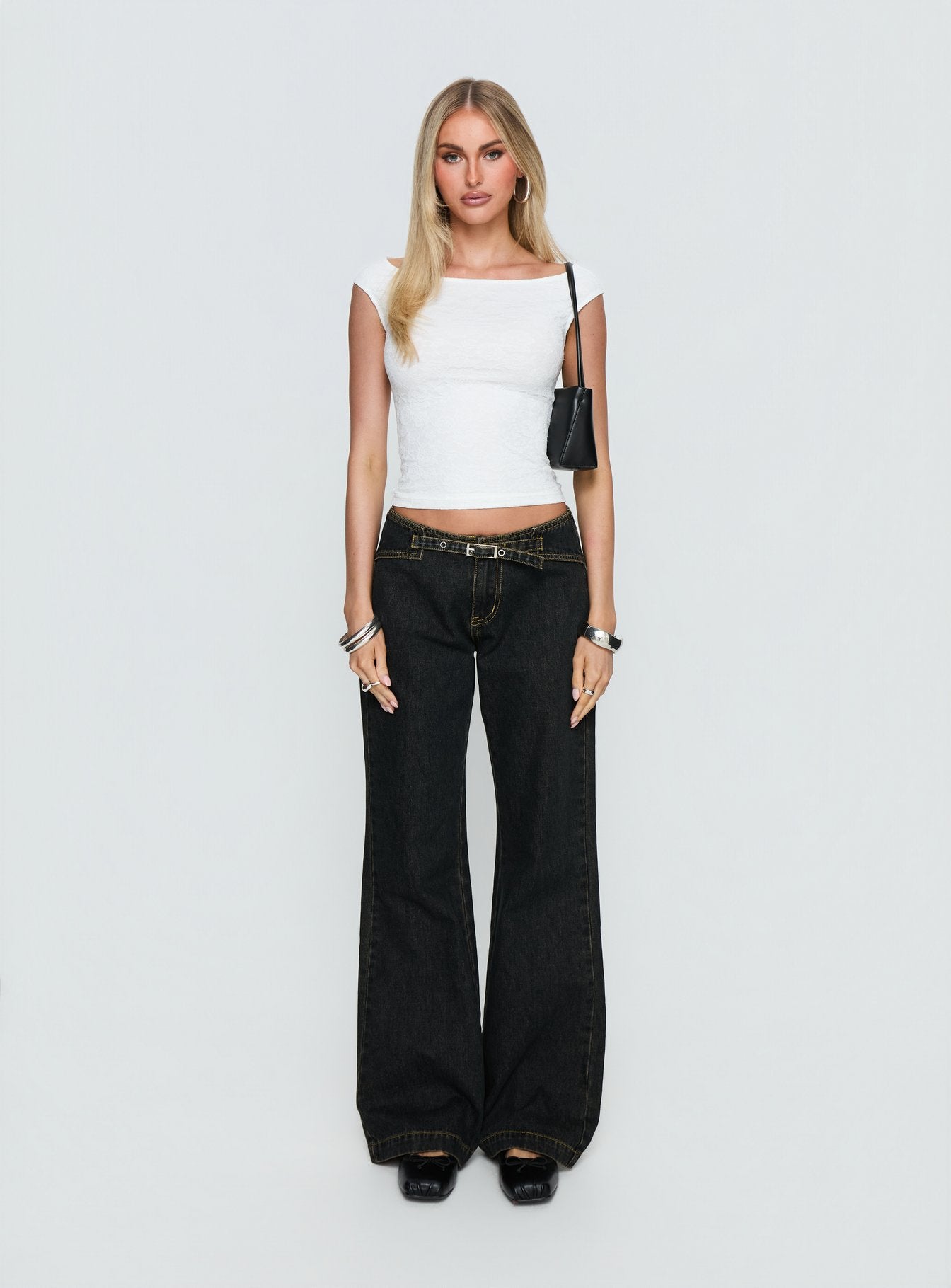 front view of model wearing Princess Polly Slow Ride Mid Rise Bootleg Belted Jeans Grunge Wash Mid Rise Jeans 