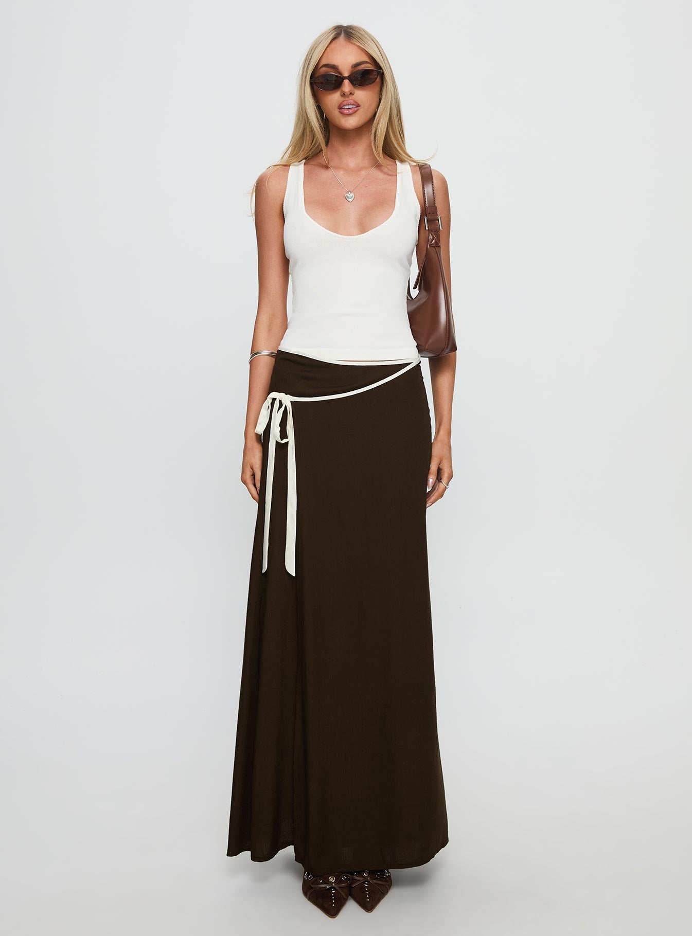   side view of model wearing Princess Polly Keirah Contrast Wrap Maxi Skirt Chocolate / White Maxi 