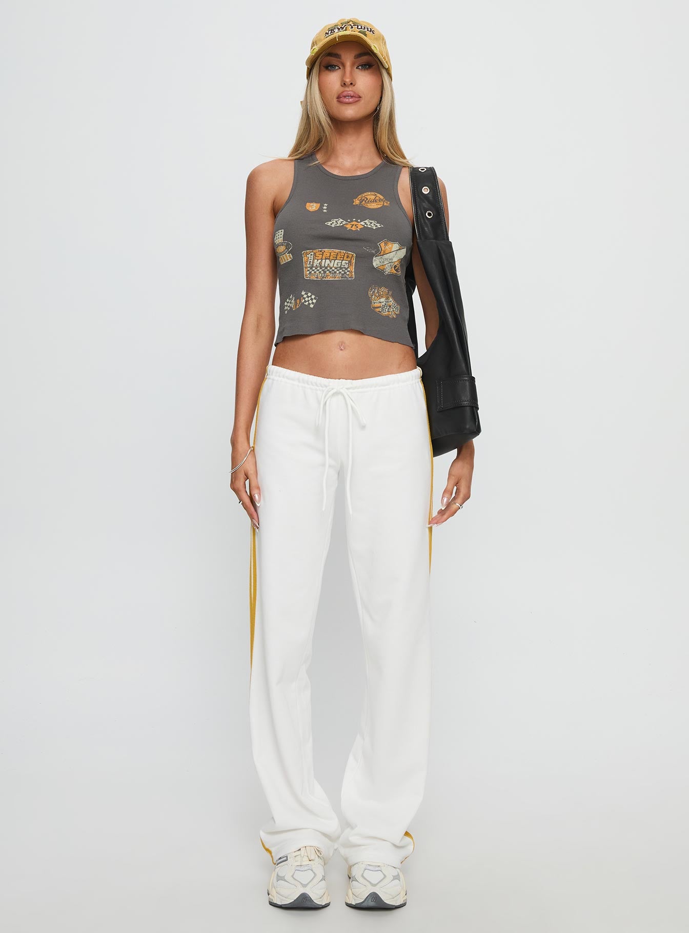 front view of model wearing Princess Polly Elation Low Rise Straight Leg Track Pant White Low Rise Pants 