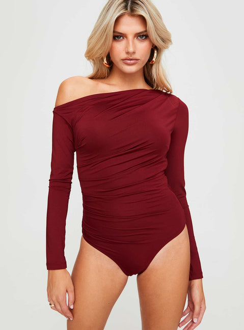 front view of model wearing Princess Polly Donner Long Sleeve Bodysuit Burgundy Full Sleeves Asymmetric Neckline 