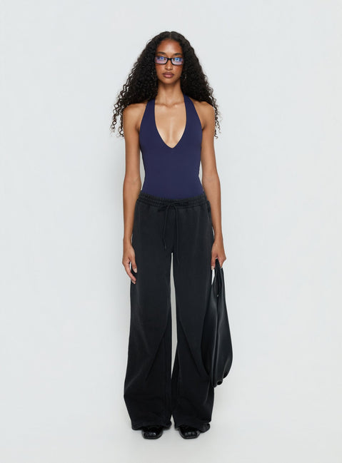 side view of model wearing Princess Polly Someone New Halter Bodysuit Navy Sleeveless 