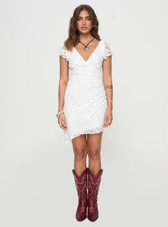 side view of model wearing Princess Polly Ramallo Lace Mini Dress White V-Neck 