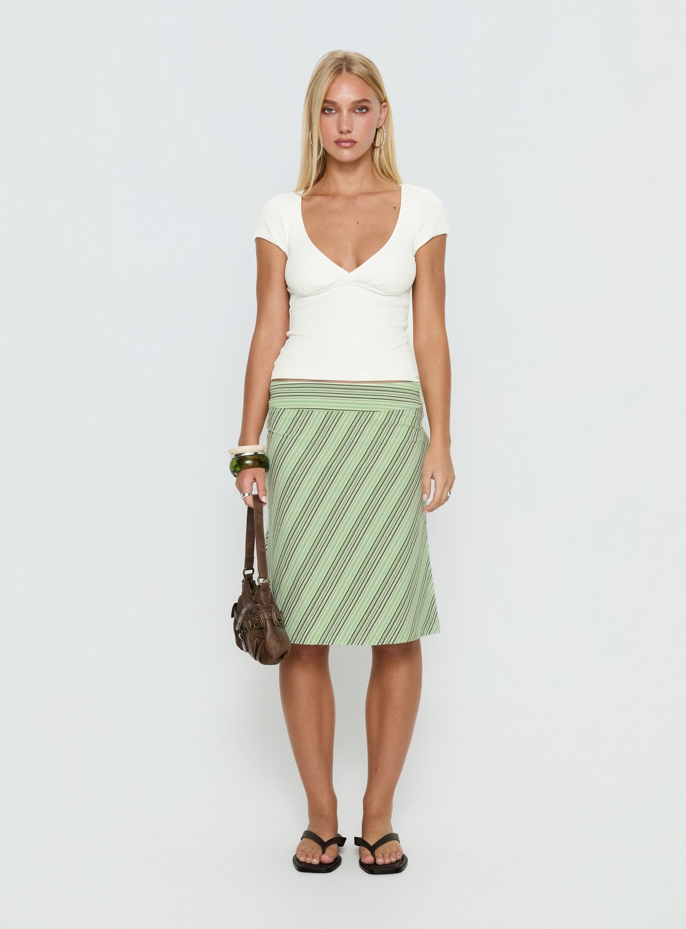   front view of model wearing Princess Polly Lemon Twist Midi Skirt Green Stripe Knee 