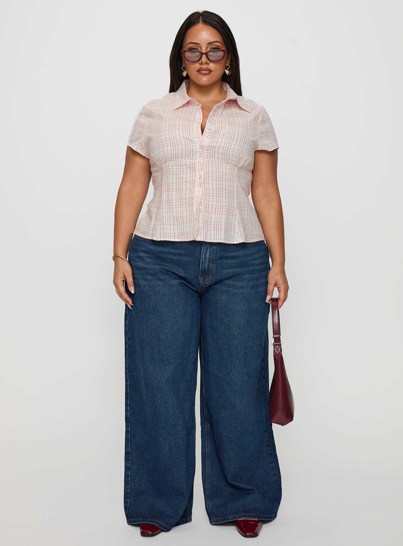 side view of model wearing Princess Polly Cottesloe Blouse Top Pink Check Curve Short Sleeves V-Neck 