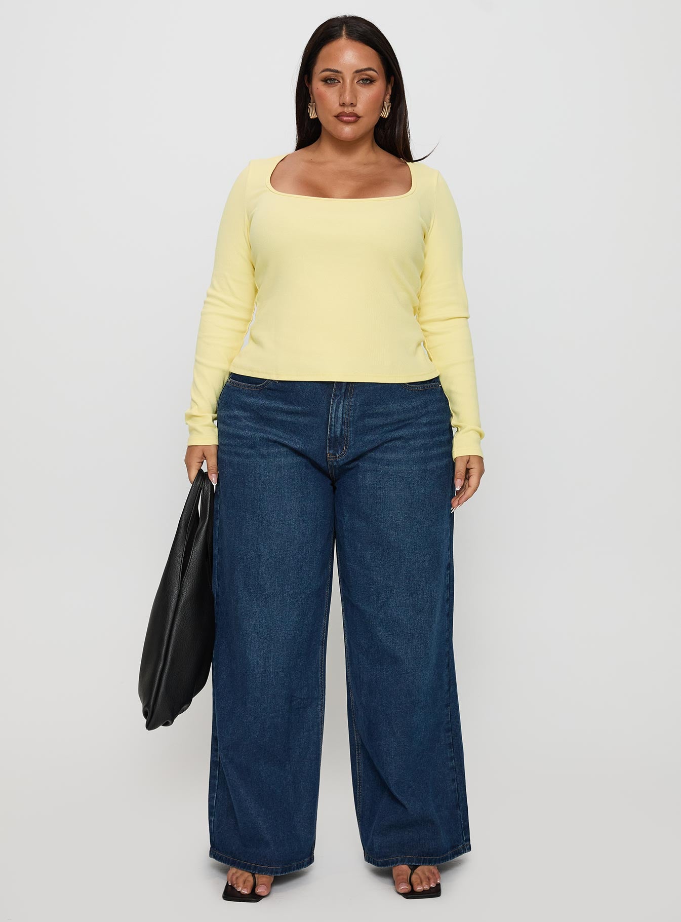 side view of model wearing Princess Polly Baseline Long Sleeve Top Yellow Curve Full Sleeves Scoop Neck 