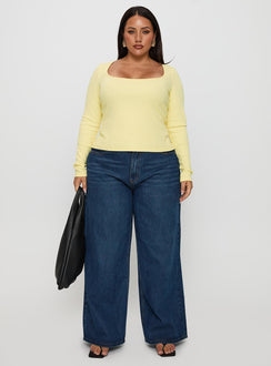 side view of model wearing Princess Polly Baseline Long Sleeve Top Yellow Curve Full Sleeves Scoop Neck 