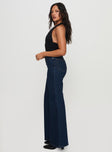 side view of model wearing Princess Polly Thearlie High Flare Jean Dark Wash High Waisted 