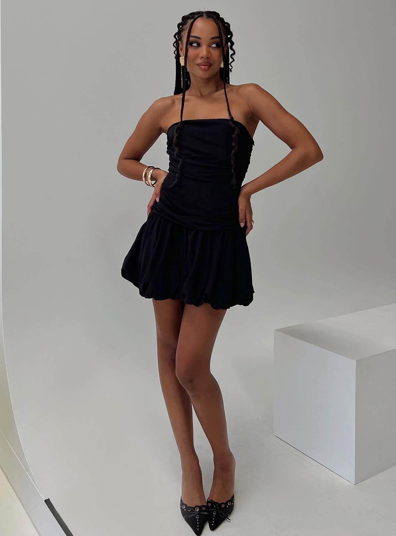 front view of model wearing Princess Polly Glamour Girl Strapless Bubble Hem Mini Dress Black Straight Neck 