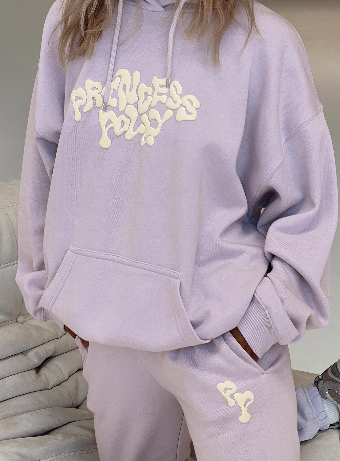 front view of model wearing Princess Polly Princess Polly Hooded Sweatshirt Squiggle Text Dusty Mauve / Eggshell regular 