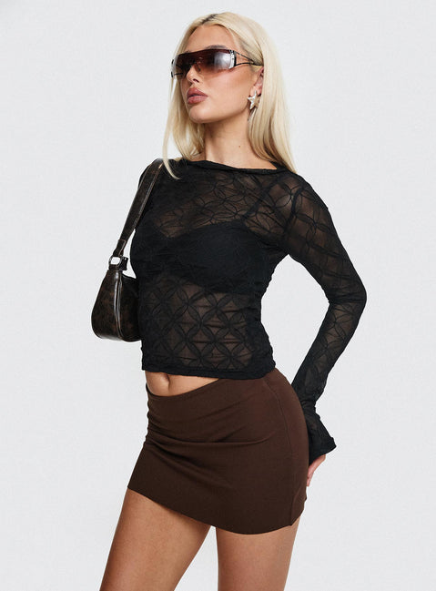   side view of model wearing Princess Polly Karley Low Waist Mini Skirt Chocolate Petite Mini Skirts 