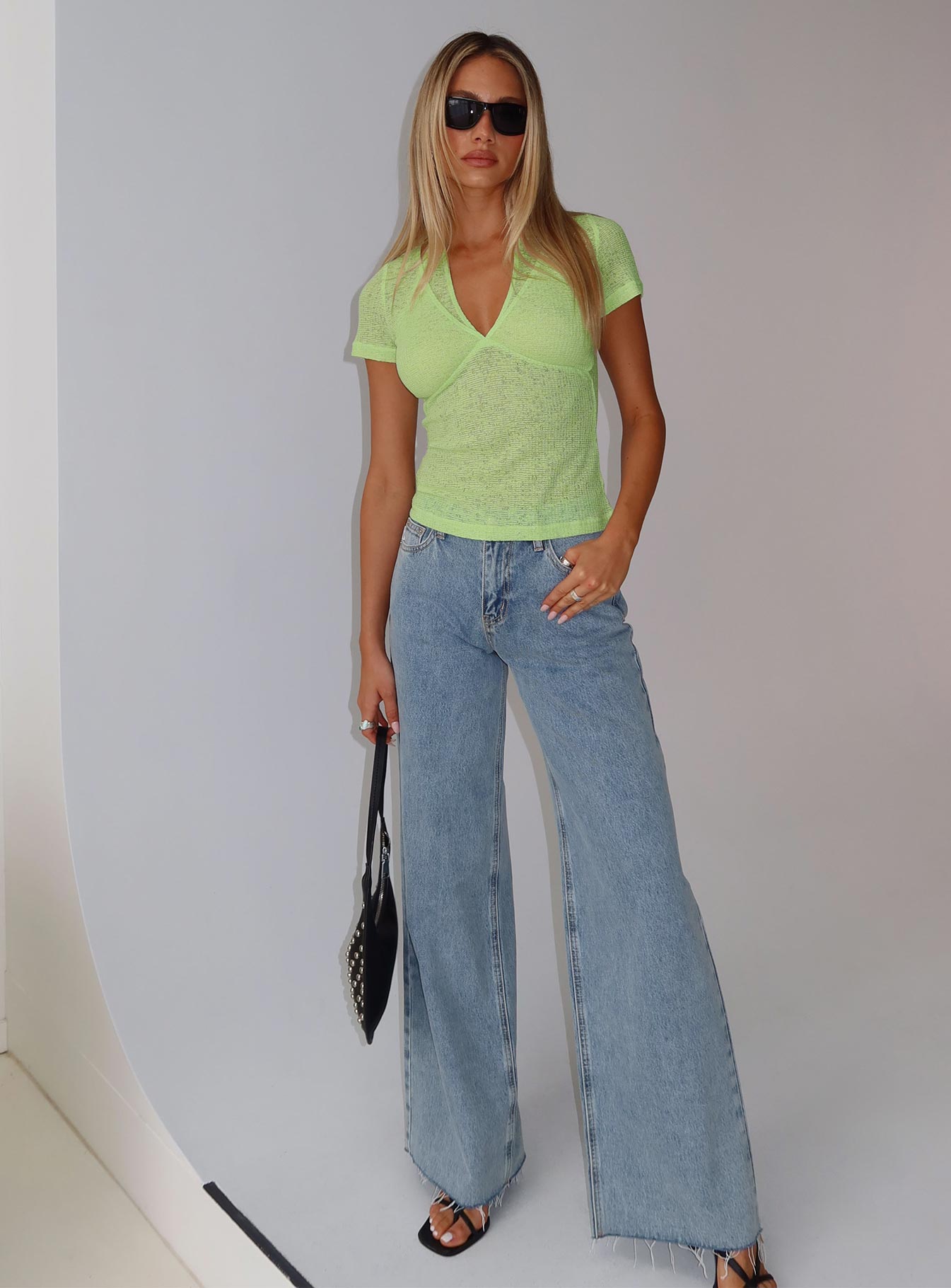 front view of model wearing Princess Polly Darla Low Rise Straight Jean Vintage Blue Wash Low Rise Jeans 
