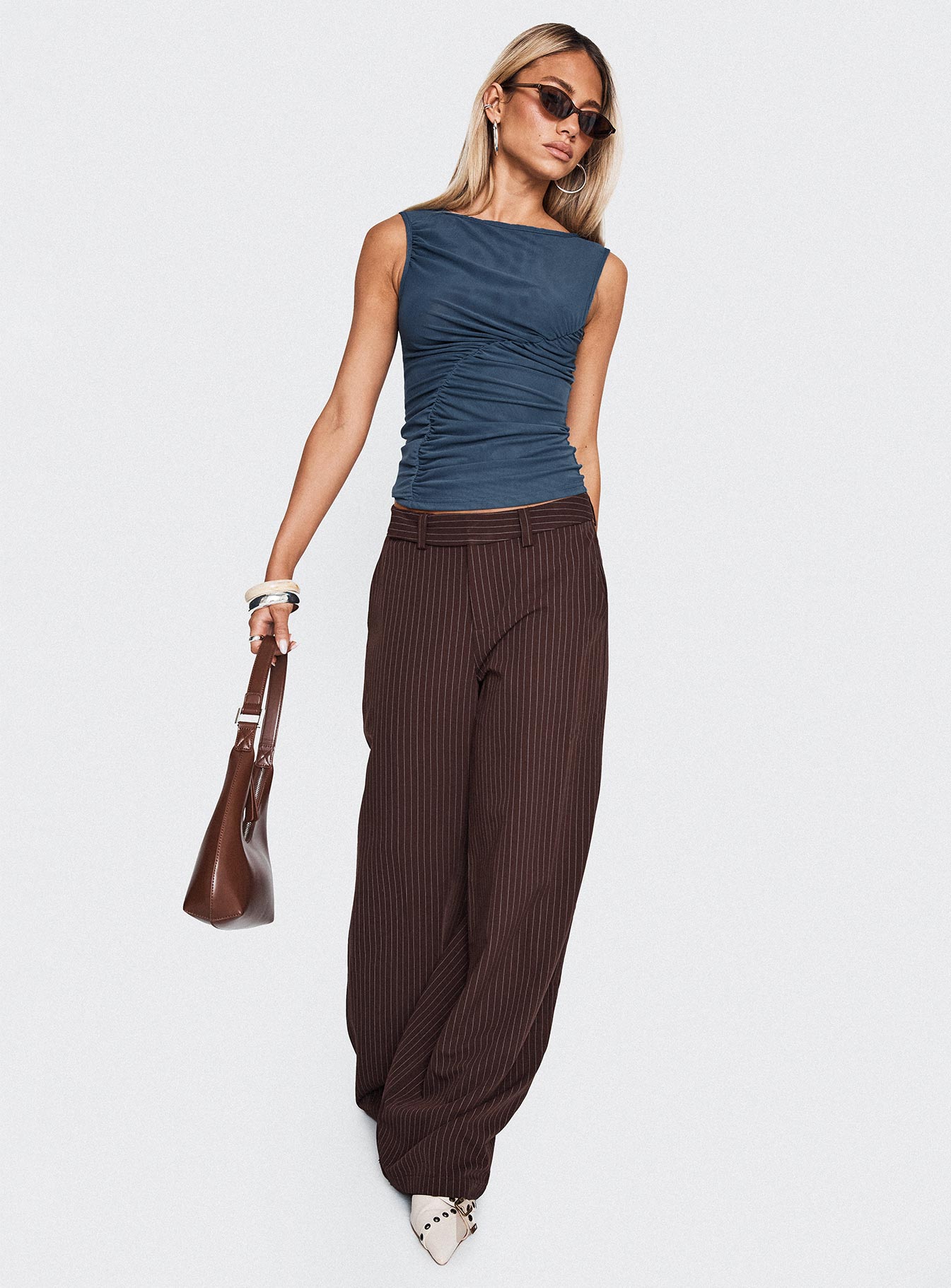 side view of model wearing Princess Polly Lustre Wide Leg Pant Brown Pinstripe Low Rise Pants 